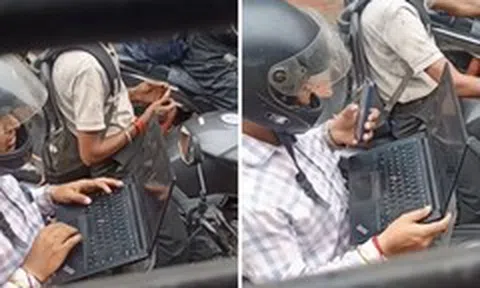 Dân mạng tranh cãi cảnh mở laptop làm việc khi dừng đèn đỏ