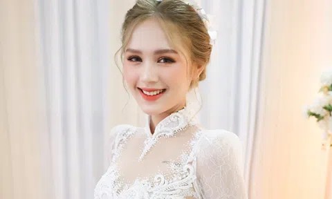 Streamer Xemesis và Trang Phạm mặc áo dài cưới 50 triệu đồng